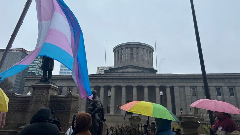 File - A group of protestors gathered outside the Ohio Statehouse on Wednesday, Jan. 24, 2024, to voice displeasure of the Senate's override of Gov. Mike DeWine's veto on a bill that would bar transgender minors from undergoing gender affirming care. AVERY KREEMER/STAFF
