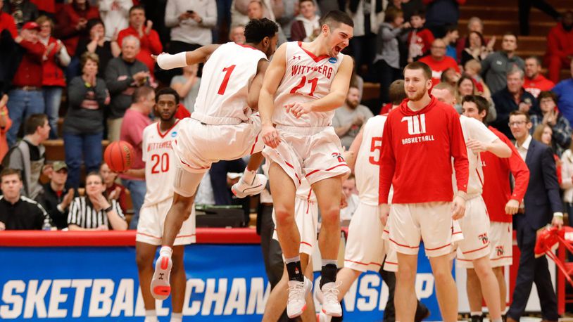 Wittenberg University senior Jake Bertemes and junior Landon Martin celebrate after beating Susquehanna 77-73 in an NCAA Division III second round game on Saturday night at Pam Evans Smith Arena in Springfield. CONTRIBUTED PHOTO BY MICHAEL COOPER