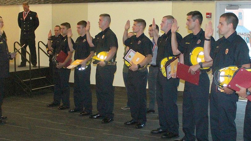 Eight new firefighters were recently sworn in to become members of the Springfield Fire Rescue Division. JEFF GUERINI/STAFF