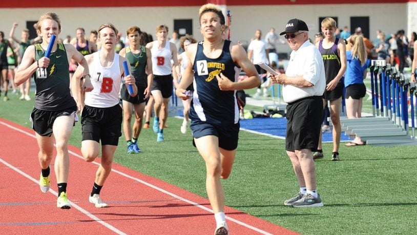 Cameron Elliott of Springfield finishes second in the boys 3,200-meter relay at the Division I district meet Wednesday at Piqua High School. GREG BILLING / CONTRIBUTED