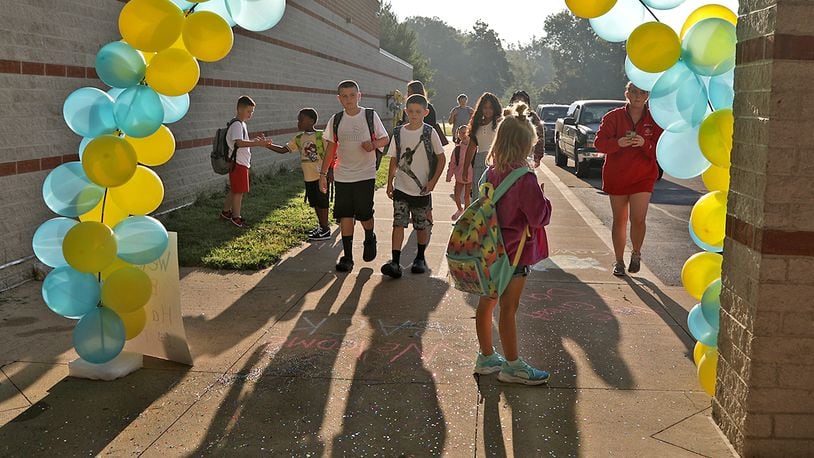 Students at Warder Park-Wayne Elementary School walk into school for the first day of school Wednesday, August 24, 2022. BILL LACKEY/STAFF