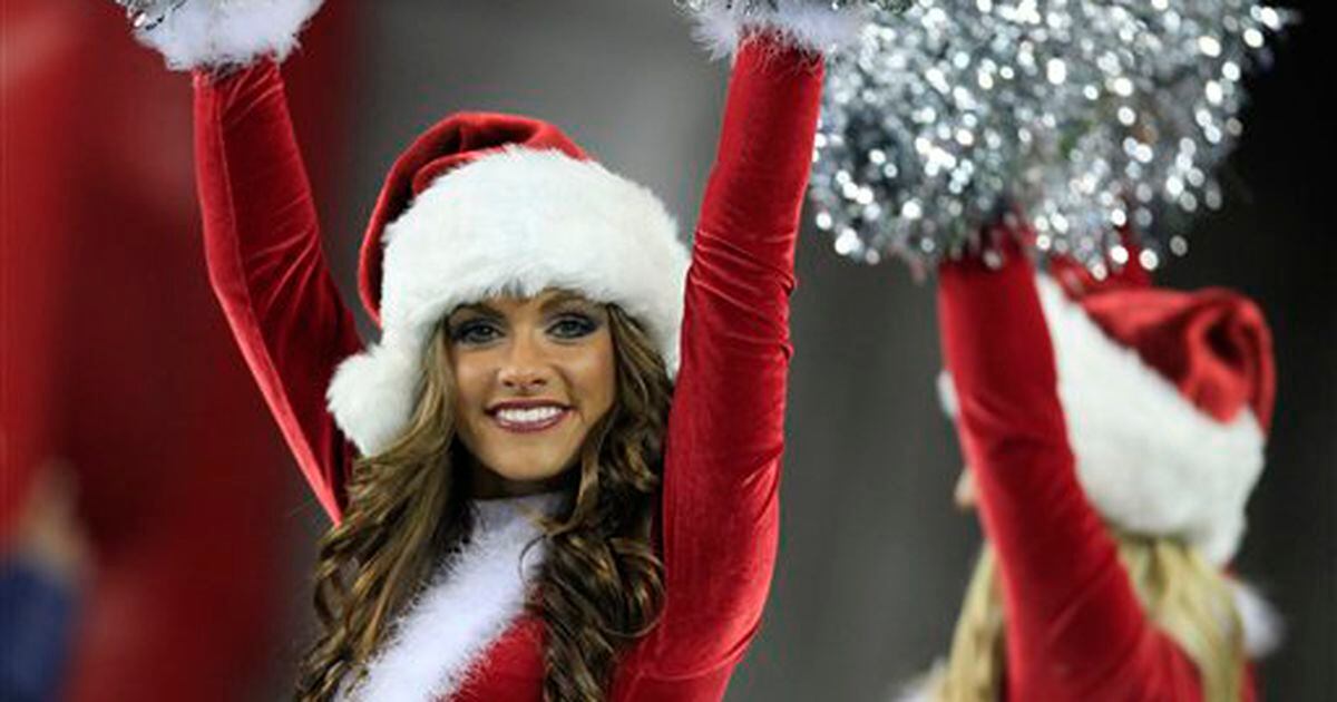 NFL cheerleaders bring the Christmas spirit as they dress in sexy Santa  outfits for half-time shows – The Sun