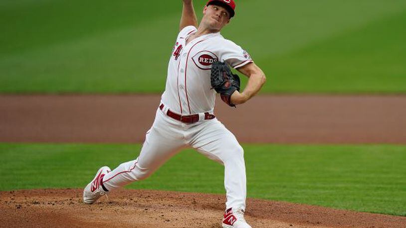 Cincinnati Reds starting pitcher Sonny Gray pitches in the first inning of the team's baseball game against the St. Louis Cardinals in Cincinnati, Tuesday, Sept. 1, 2020. (AP Photo/Bryan Woolston)