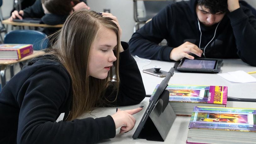 Students at Springfield High School use ipads in class Friday. Students will have to use their ipads to access their school work while they’re off for at least four weeks. BILL LACKEY/STAFF