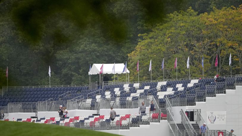 Empty seats on a grandstand are seen on the first hole during a Solheim Cup golf tournament foursomes match at Robert Trent Jones Golf Club, Friday, Sept. 13, 2024, in Gainesville, VA. (AP Photo/Matt York)