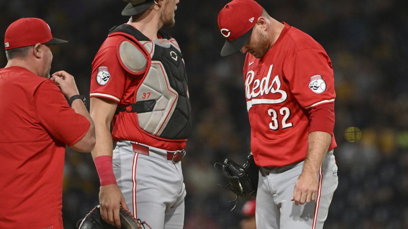 Cincinnati Reds pitcher Justin Wilson (32) reacts during the sixth inning of a baseball game against the Pittsburgh Pirates, Friday, Aug. 23, 2024, in Pittsburgh. (AP Photo/Barry Reeger)