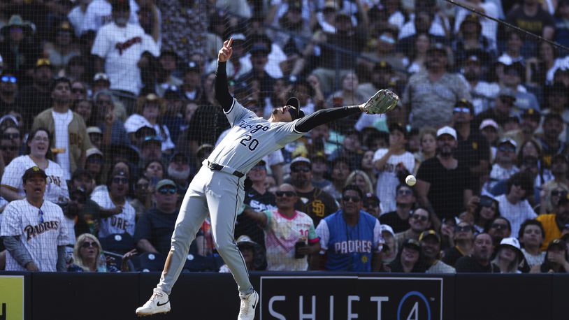 Chicago White Sox third baseman Miguel Vargas cannot catch a pop fly hit by San Diego Padres' Jackson Merrill in the seventh inning of a baseball game Sunday, Sept. 22, 2024, in San Diego. (AP Photo/Derrick Tuskan)