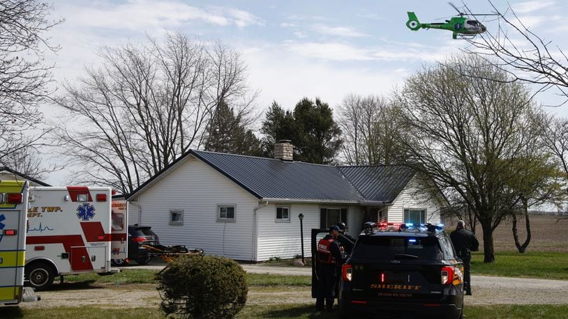 The Clark County Sheriff's Office investigates a shooting at a home in the 7000 block of South Charleston-Clifton Road Monday, March 25, 2024. Deputies arrived at the home to find the a woman shot in the driveway and an 81-year-old man who had been assaulted. The woman was flown by MedFlight to Kettering Health Main Campus, where she later died, while the man was transported to the hospital by medic. BILL LACKEY/STAFF