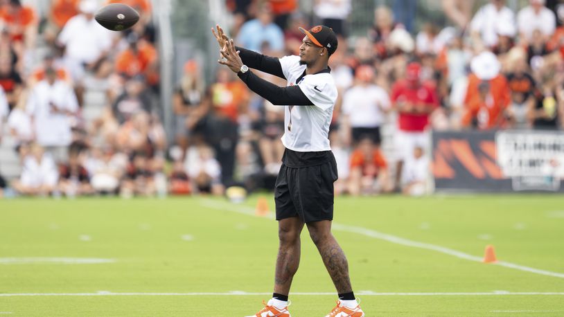 Cincinnati Bengals wide receiver Ja'Marr Chase (1) catches a pass during the NFL football team's training camp on Wednesday, July 24, 2024, in Cincinnati. (AP Photo/Emilee Chinn)