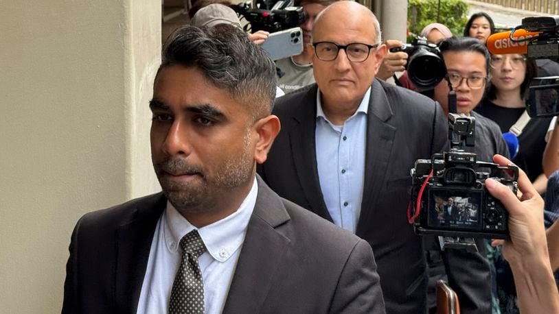 Former Transport Minister S. Iswaran, left, and his lawyer Mr. Navin Thevar arrive at the High Court in Singapore, July 5, 2024. (AP Photo)