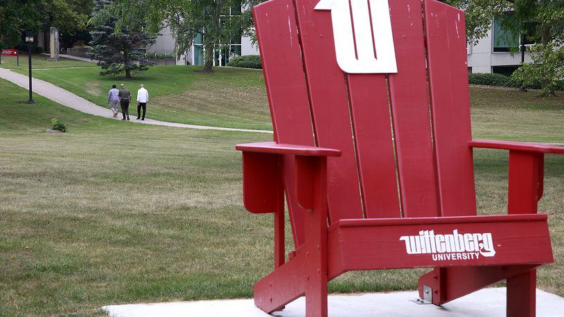 Three men walk across the campus of Wittenberg University Thursday, August 1, 2024. BILL LACKEY/STAFF