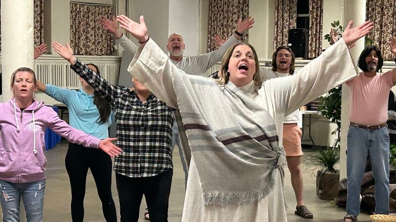 Annette Turner, portraying Mary Magdalene, rehearses a song she sings lead on backed by fellow cast members during a rehearsal of "Acts," a new original musical based on the Bible book and the story of the Apostles coming to the John Legend Theater.