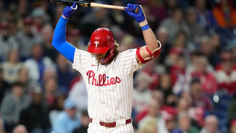 Philadelphia Phillies' Alec Bohm reacts after striking out against Chicago Cubs pitcher Hayden Wesneski during the eighth inning of a baseball game, Tuesday, Sept. 24, 2024, in Philadelphia. (AP Photo/Matt Slocum)