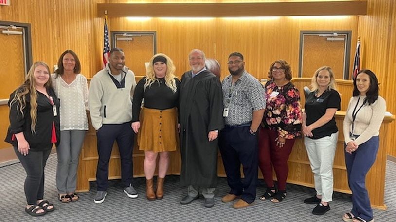 Stephanie Beechler (fourth from left), Clark County Municipal Court's first DRUG Court graduate. Contributed