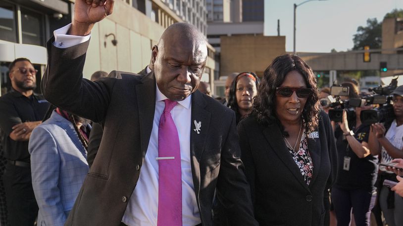 Attorney Ben Crump, left, RowVaughn Wells, right, leave the federal courthouse after three former Memphis police officers were convicted of witness tampering charges in the 2023 fatal beating of Tyre Nichols, Thursday, Oct. 3, 2024, in Memphis, Tenn. (AP Photo/George Walker IV)