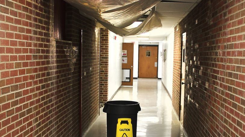 A water leak in one of the hallways at Northeastern High School is one of the reasons the school district wants to build new schools. JEFF GUERINI/STAFF