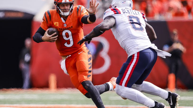 Bengals quarterback Joe Burrow runs the ball during their 16-10 loss to New England Patriots Sunday, Sept. 8, 2024 at Paycor Stadium in Cincinnati. NICK GRAHAM/STAFF