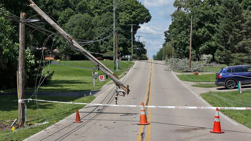 Leffel Lane is still closed Monday, July 31, 2023 due to a broken utility pole that fell during Saturday's early morning storm. The road is closed from East Possum Road to Cheviot Hills Drive. BILL LACKEY/STAFF