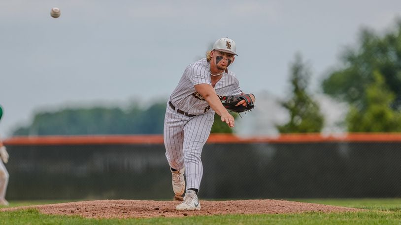 Cutline: Kenton Ridge High School junior Jake Beard delivers a pitch during their Division II district final game against Chaminade Julienne on Thursday night at Arcanum High School. Beard threw a one-hitter as the Cougars won 3-0. Michael Cooper/CONTRIBUTED