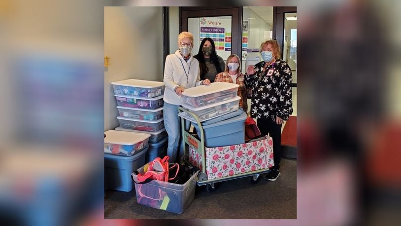 The Clark State College Early Childhood Education (ECE) program students will host the second annual Duffle Shuffle through Nov. 18. Here are the employees of Clark County Children Services with the 2021 donations. Contributed/Clark State College