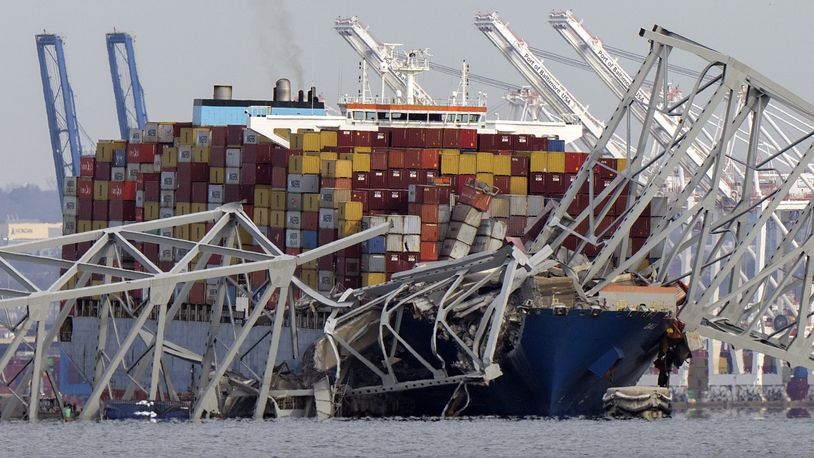 FILE - The cargo ship Dali is stuck under part of the structure of the Francis Scott Key Bridge after the ship hit the bridge, Tuesday, March 26, 2024, as seen from Pasadena, Md. (AP Photo/Mark Schiefelbein, File)