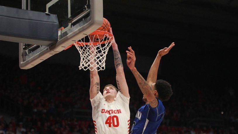 Dayton’s Chase Johnson dunks against Indiana State on Saturday, Nov. 9, 2019, at UD Arena. David Jablonski/Staff