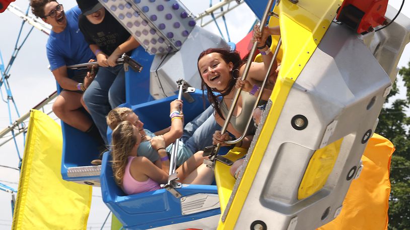 Fairgoers enjoy the rides on the midway at the Clark County Fair Wednesday, July 24, 2024. BILL LACKEY/STAFF