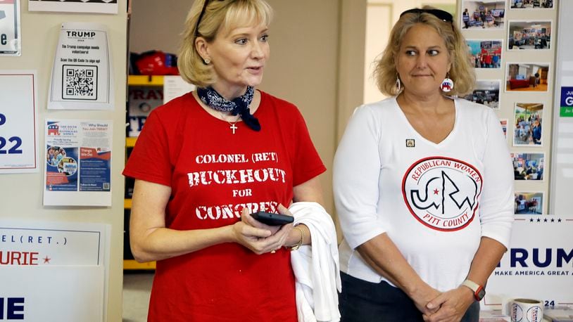 Congressional candidate Laurie Buckhout, R-N.C., left, speaks to supporters at the Nash County Republican headquarters in Rocky Mount, N.C., Friday, Sept. 20, 2024. (AP Photo/Karl B DeBlaker)