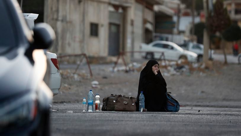 A Lebanese fleeing the Israeli bombardment, arrives at the Syrian-Lebanese border crossing in Jdaidet Yabous, Syria, Tuesday, Sept. 24, 2024. (AP Photo/Omar Sanadiki)