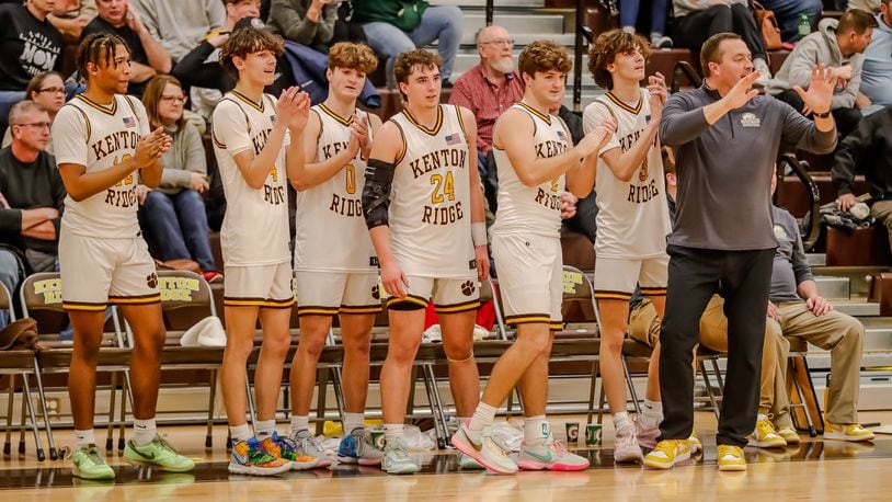 The Kenton Ridge senior class (from left to right): Tyrinn Robinson, Canye Rogan, Braden Smith, Logan Fyffe, Bryce Smith and Ckai Rogan, celebrates with coach Brian Smith after clinching a share of the CBC Kenton Trail Division title last month. Michael Cooper/CONTRIBUTED