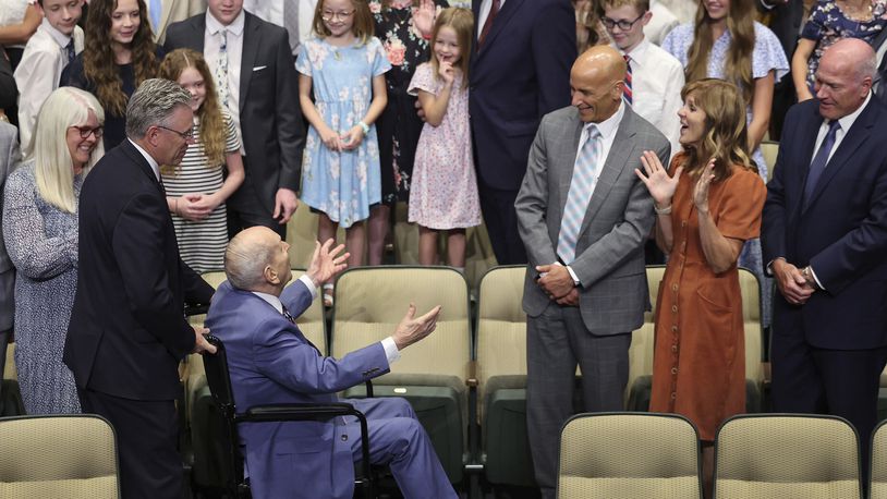 President Russell M. Nelson of The Church of Jesus Christ of Latter-day Saints greets his family prior to a photo during his 100th birthday celebration at the Little Theatre of the Conference Center in Salt Lake City, Monday, Sept. 9, 2024. (Jeffrey D. Allred/The Deseret News via AP, Pool)