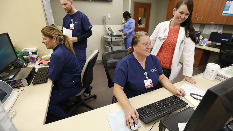 A group of nurses work at a nurses station in the Emergency Department of Springfield Regional Medical Center. Bill Lackey/Staff