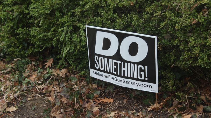 Six months after a 24-year-old Bellbrook man killed nine people in the Oregon District during the worst mass shooting in Ohio history, literal signs of strength, appreciation, resilience and the determination to “do something” about gun violence can be found throughout the historic neighborhood. "Do Something" signs are in several residential yards. AMELIA ROBINSON/STAFF