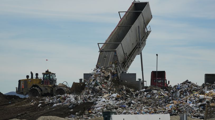 FILE - Trash is unloaded at the Otay Landfill in Chula Vista, Calif., Jan. 26, 2024. (AP Photo/Damian Dovarganes, File)