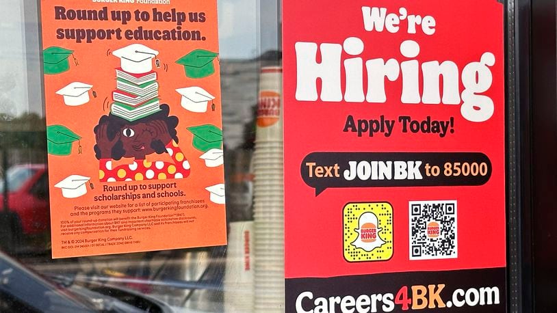 A sign seeking job applicants is displayed at a restaurant in Wheeling, Ill., Thursday, May 16, 2024. On Thursday, May 23, 2024, the Labor Department reports on the number of people who applied for unemployment benefits last week.(AP Photo/Nam Y. Huh)
