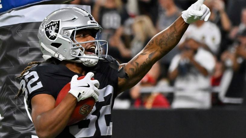 Las Vegas Raiders wide receiver Tyreik McAllister (32) celebrates after returning a punt for a touchdown against the San Francisco 49ers during the first half of an NFL preseason football game, Friday, Aug. 23, 2024, in Las Vegas. (AP Photo/David Becker)