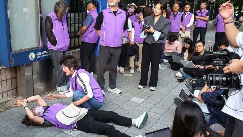 Bereaved family members of the victims of the Halloween crush in 2022 react at the Seoul Western District Court in Seoul, South Korea, Monday, Sept. 30, 2024. (Kim Geun-soo/Newsis via AP)