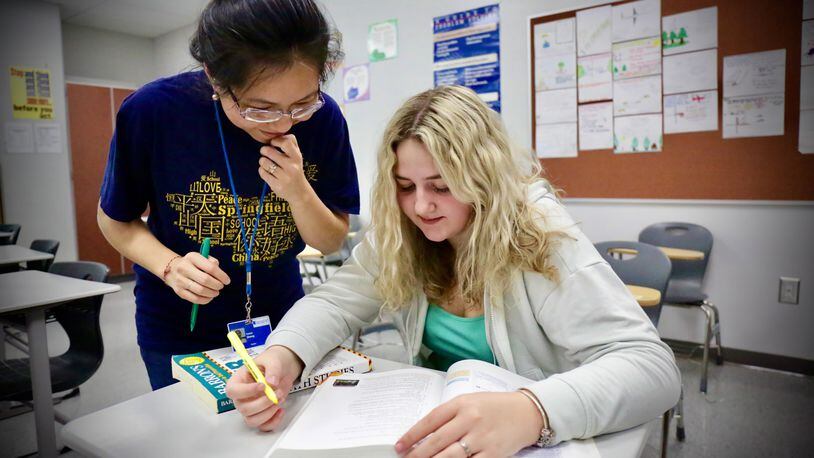 A 2022 Springfield High School graduate in the International Baccalaureate (IB) program with IB math teacher Zoe Zhong. Contributed