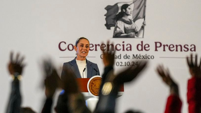 Mexican President Claudia Sheinbaum gives a media briefing from the National Palace in Mexico City, Wednesday, Oct. 2, 2024, the morning after her inauguration. (AP Photo/Fernando Llano)