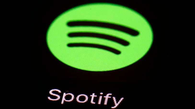 FILE- This March 20, 2018 file photo shows the Spotify app on an iPad in Baltimore. (AP Photo/Patrick Semansky, File)