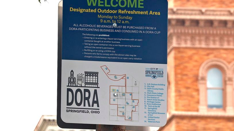 Springfield City Commission is considering expanding the Downtown Outdoor Refreshment Area to include as far south as the Clark State Performing Arts Center and north toward the Veterans Park area. The city’s DORA allows patrons to purchase alcohol in specified cups and walk in the designated areas. BILL LACKEY/STAFF