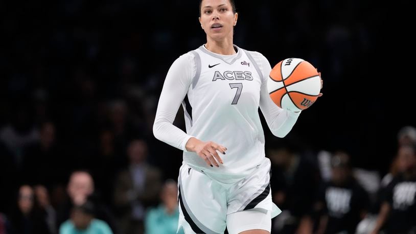 Las Vegas Aces' Alysha Clark (7) looks to pass during the second half of a WNBA basketball semifinal game against the New York Liberty, Tuesday, Oct. 1, 2024, in New York. The Liberty won 88-84. (AP Photo/Frank Franklin II)