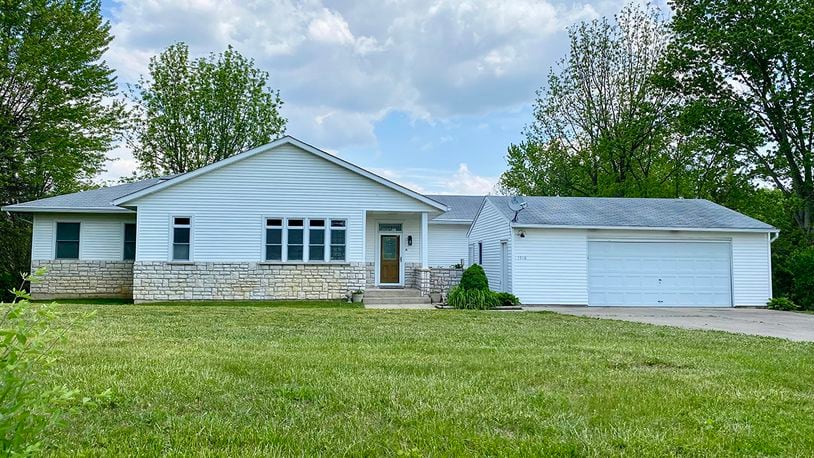 The 3-bedroom ranch with about 2,300 sq. ft. of living space features a half stone wrap façade and vinyl siding. A 2-car, detached garage is also in the front, and there are two exterior doors off the front porch. The home includes a finished, full basement. CONTRIBUTED PHOTO