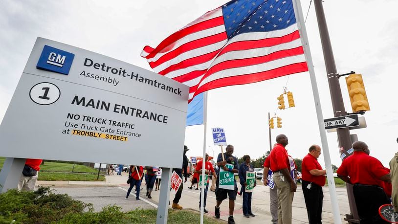 Striking United Auto Workers (UAW) union members picket at the General Motors Detroit-Hamtramck Assembly Wednesday in Detroit. (Photo by Bill Pugliano/Getty Images)