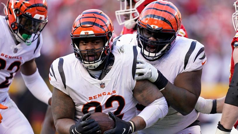 Cincinnati Bengals defensive end B.J. Hill (92) celebrates after intercepting a pass during the second half of the AFC championship NFL football game against the Kansas City Chiefs, Sunday, Jan. 30, 2022, in Kansas City, Mo. (AP Photo/Ed Zurga)