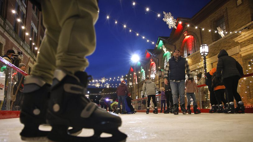 The city's outdoor ice skating rink opened for Springfield's Holiday in the City Grand Illumination Friday, Nov. 24, 2023. The annual lighting the city's Christmas tree and turning on of the holiday lights throughout downtown starts a month of activities in the downtown area. BILL LACKEY/STAFF