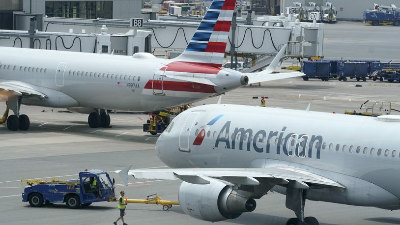 FILE - American Airlines passenger jets prepare for departure, July 21, 2021, near a terminal at Boston Logan International Airport in Boston. (AP Photo/Steven Senne, File)