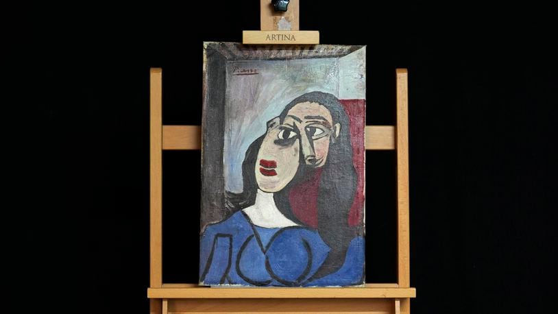 A painting is seen at a restoration laboratory in Milan, Italy, Thursday, Oct. 3, 2024. An Italian family hopes to prove definitively that a painting discarded from a villa on Capri more than 60 years ago is a Picasso. (AP Photo/Antonio Calanni)