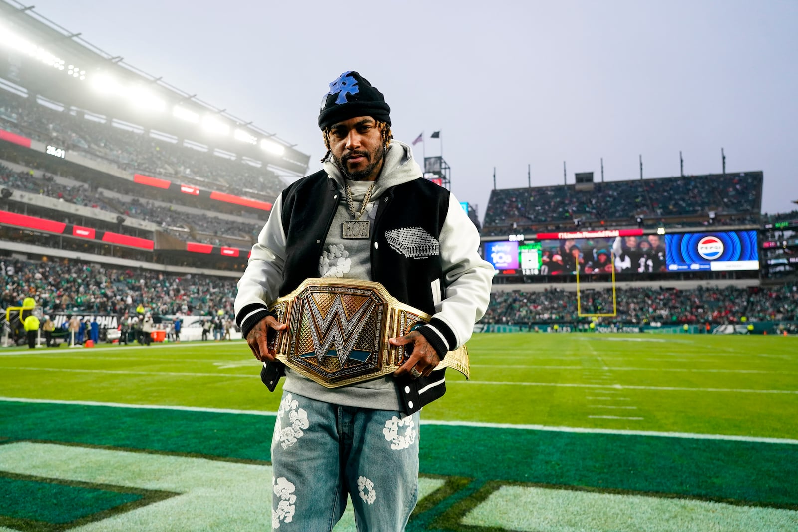 FILE -Former Philadelphia Eagles wide receiver DeSean Jackson poses with the WWE belt prior to an NFL football game between the Eagles and the San Francisco 49ers, Sunday, Dec. 3, 2023, in Philadelphia. (AP Photo/Chris Szagola, File)