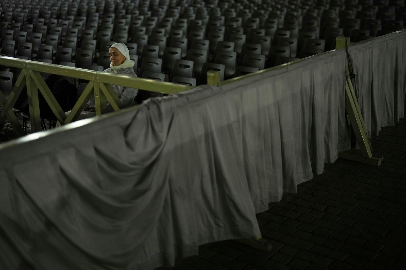 A Catholic nun arrives for a prayer of the Rosary for Pope Francis in St. Peter's Square at The Vatican, Sunday, March 9, 2025. (AP Photo/Francisco Seco)